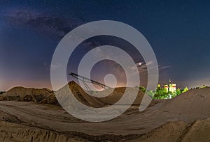 Conveyor bridge at night and the milky way, watching the stars at a construction area.