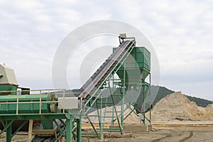 conveyor and pile of quarry stone