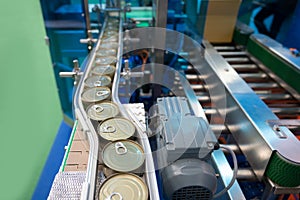 Conveyor for the production of cans in factory. closed tin cans - Canned foods industry.