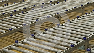 Conveyor rollers in a warehouse. Conveyor system. Empty conveyors, enterprise crisis.