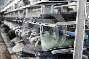 The conveyor on a shoes factory with shoe and sole. Mass production of footwear.