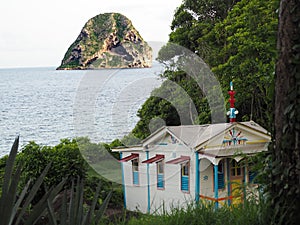 The convict`s house and the Diamond Rock on the island of Martinique in the French West Indies photo