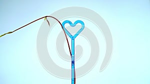 Convolvulous plant curling spinning around blue heart surreal scene love dream