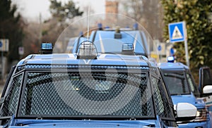 Convoy with several police cars and armored vehicles on patrol t