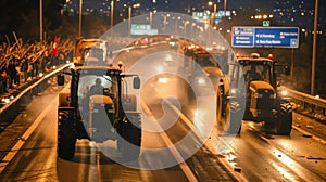 A convoy of tractors with activated lights participating in a rally on a busy urban road.