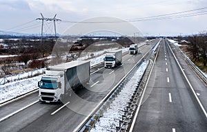 Convoy of Trucks in Winter
