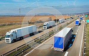 Convoys of transportation trucks passing on a highway