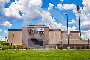 Back of LongHorn Steakhouse with blue sky