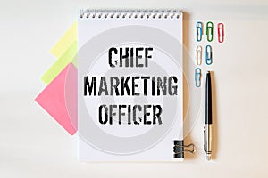 COO- Chief Operating Officer written in a notebook on white table