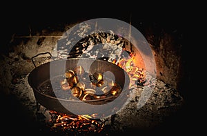 Coocking chestnuts on burning coals