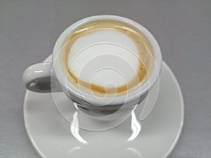 Coofee with milk on a mug