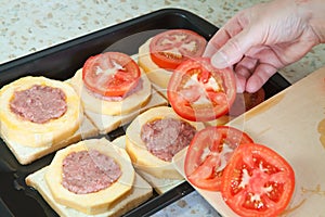 Cook adds tomato on stuffed vegetable marrow