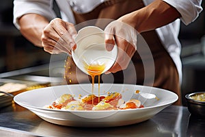 Cook in apron adding some sauce to dish. Cropped chef preparing food, meal, in kitchen, chef cooking, Chef decorating dish,