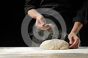 Cook baker prepares bread, focaccia, pizza, buns, sweets. Horizontal photo. Bakery concept, cooking flour products. Design for