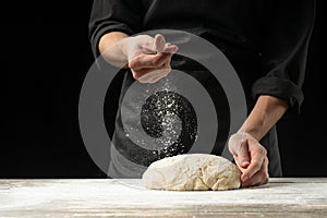 Cook baker prepares bread, focaccia, pizza, buns, sweets. Horizontal photo. Bakery concept, cooking flour products. Design for