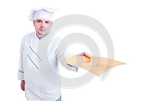 Cook or chef holding and serving an empty plate