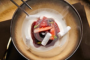 Cook chef making fruit ice cream added liquid nitrogen