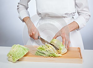 Cook chopping savoy cabbage