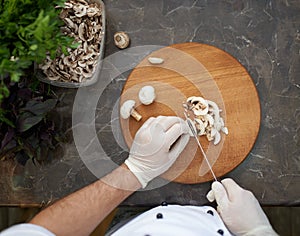 Cook chops ceps firstperson view photo