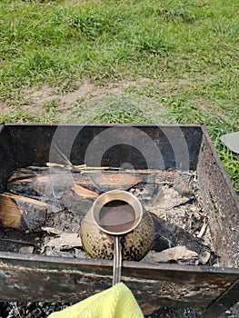 Cook coffee on the coals in nature