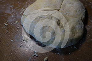 The cook from the dough begins to make baking dishes