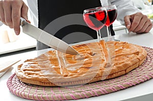 Cook and empanada gallega, a savory stuffed cake typical of Spain photo
