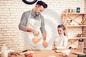 Cook Food at Home. Father Feeds Daughter. Pour Juice in Glass. Happy Family. Father`s Day. Girl and Man Cook Food. Man and Child