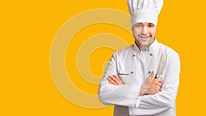 Cook Guy Holding Kitchen Knife Standing Over Yellow Background, Panorama