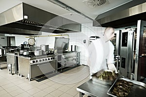 Cook in industrial kitchen