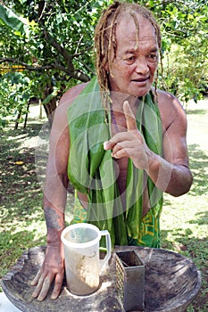 Cook Islander man prepares Kava drink in Rarotonga Cook Island