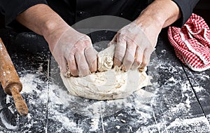Cook kneads white wheat flour dough
