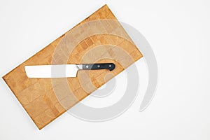 Cook Knife on the wooden endgrain cutting board above white background