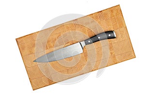 Cook Knife on the wooden endgrain cutting board above white background