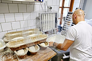 Russia, Moscow,10.06.2019, the cook makes slices of dough and puts in a row in a bowl, pastries, flour products