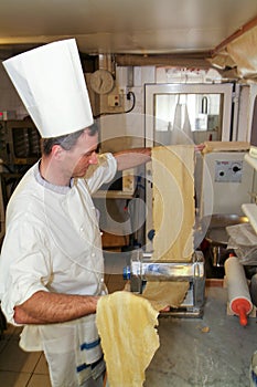 Cook making fresh egg pasta