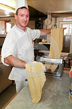 Cook making fresh egg pasta