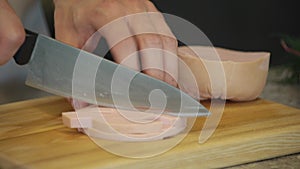 Cook Man Cutting Boiled Sausage on Wooden Board