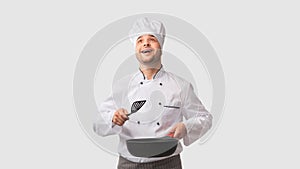 Cook Man Holding Pan And Spatula Looking Up, White Background