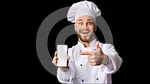 Cook Man Showing Phone Empty Screen Standing On Black Background