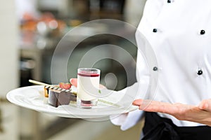 Cook, pastry chef, in hotel or restaurant kitchen