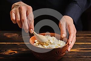 Cook prepares a dish of rustic cottage cheese