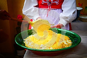 The cook prepares Mamaliga,  Romanian traditional food from Salaj photo