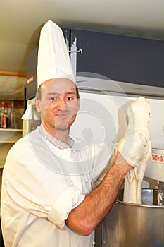 Cook preparing the dough of fresh egg pasta