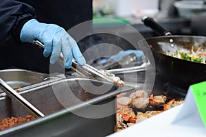 Cook preparing food outdoors