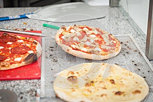 cook pulls lave baked pizza