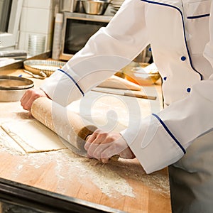Cook rolling dough kitchen with rolling pin
