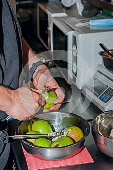 Cook`s hands clean the pear. Preparation of the pears to caramelize and cook chutney. Close up