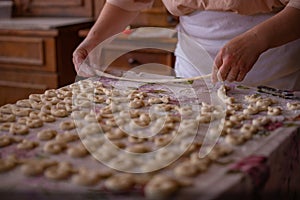 Cook's hands kneading dough for cakes. Preparing the flour for leavening