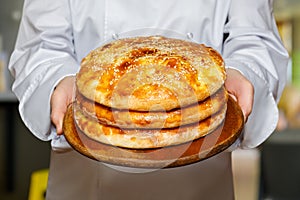 The cook shows pitas bread