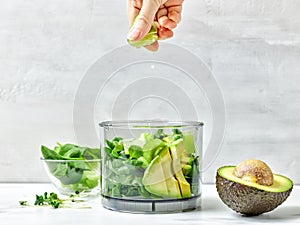 Cook squeezing lime into blender container